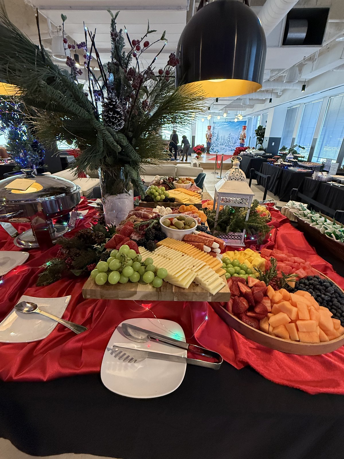 Lavish grazing and charcuterie table with fruit, cheeses, and cured meats
